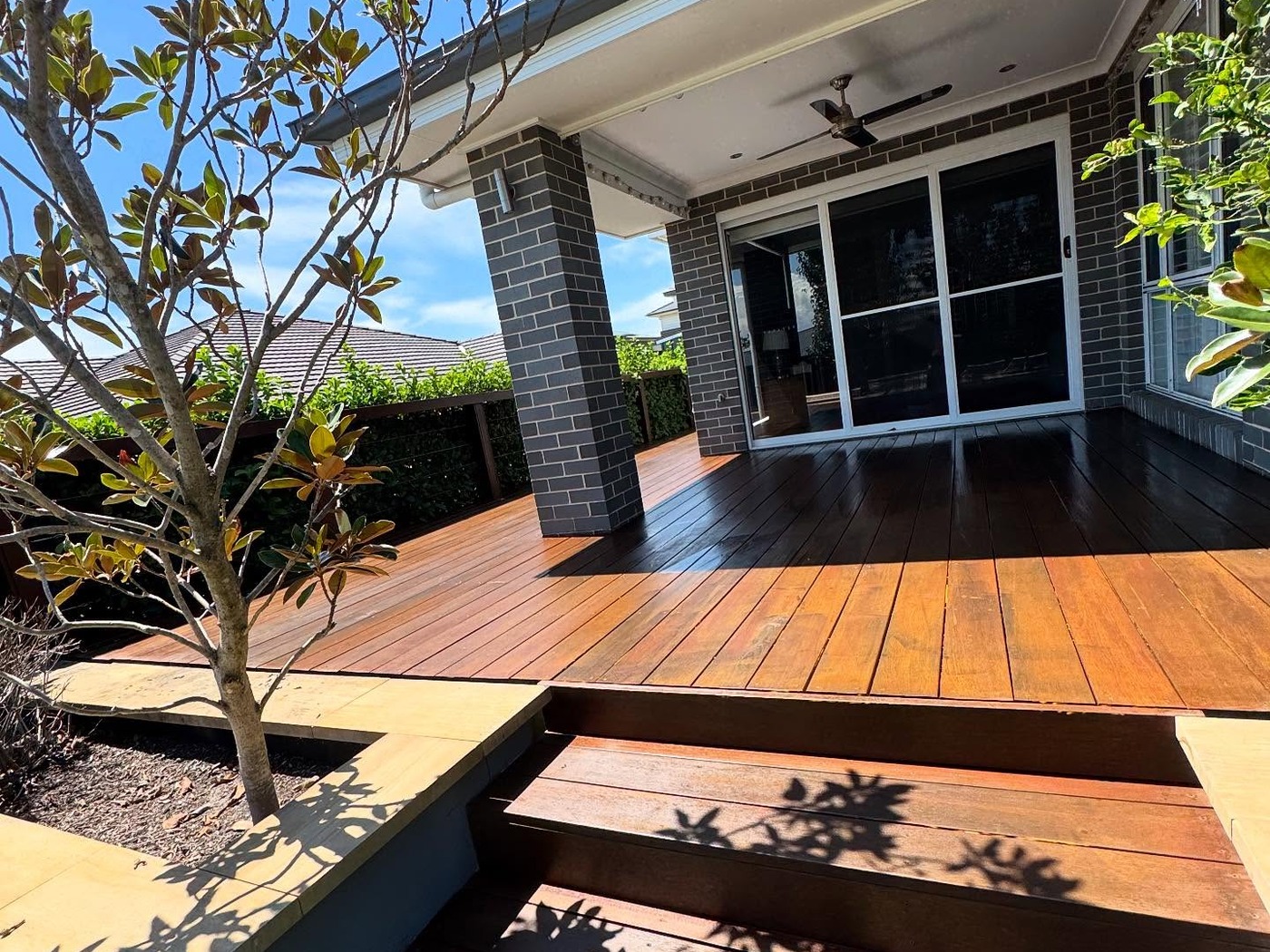 Hardwood timber deck with steps in a backyard